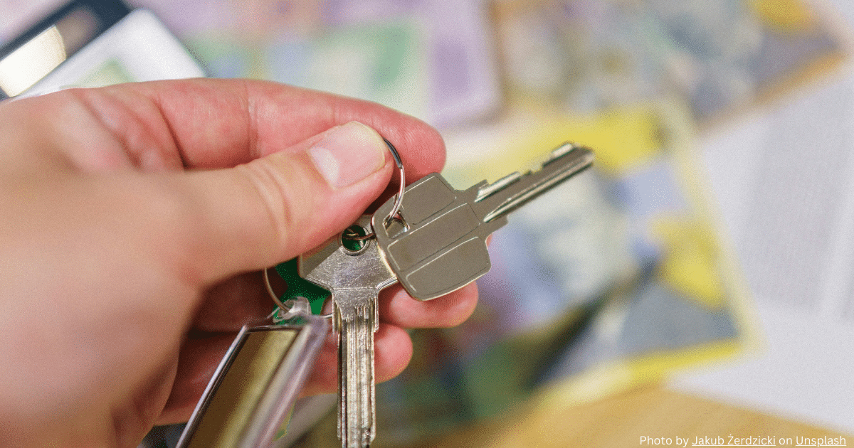 A hand holding a key, symbolizing the concept of unlocking potential with the Kaizen method